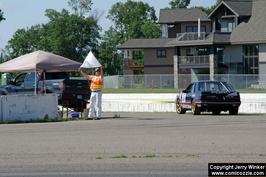 Team Motorcrap Ford Mustang pulls off the track at turn 13.