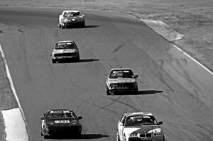 Five cars head out of turn 5 and into turn 6.