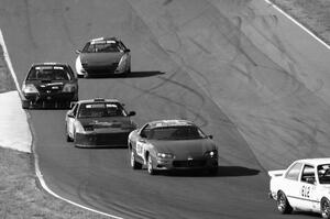 A group of cars heads into turn 6.