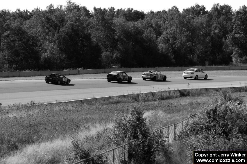 Behind the pace car: NNM Motorsports Dodge Neon, rbankracing.com SAAB 9-3 and Just in Time Toyota MR2