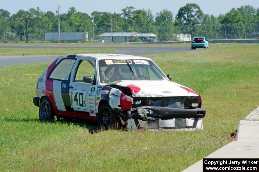 Virtually Worthless VW Golf had its day end after hitting the inside wall exiting turn 3.