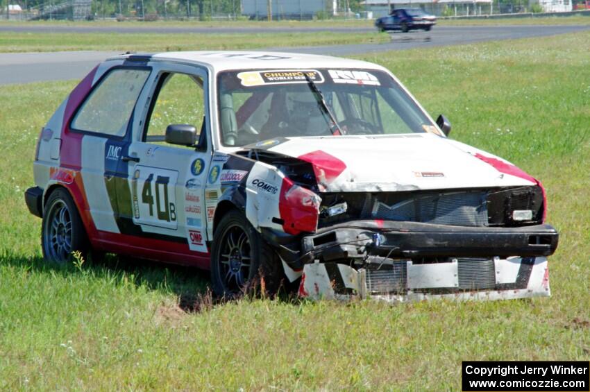 Virtually Worthless VW Golf had its day end after hitting the inside wall exiting turn 3.