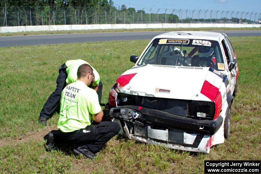 Virtually Worthless VW Golf had its day end after hitting the inside wall exiting turn 3.