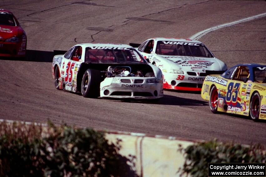 (35) Ricky Bryant's Pontiac Grand Prix shows battle scars