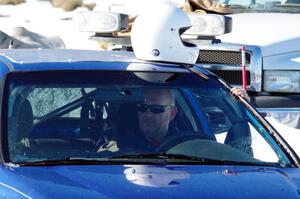 Mark Utecht sits in his Honda Civic prior to a sprint race.