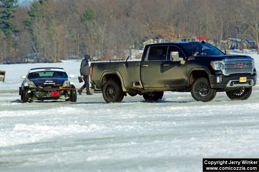 One of the Texas Drift Academy's Nissan 350Zs gets pulled from a snowbank.