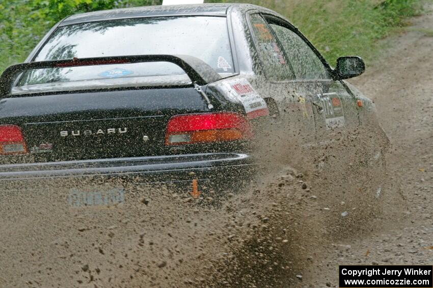 Kristian Rue / Mark Rue Subaru Impreza 2.5RS at a sharp left on SS3, Steamboat I.