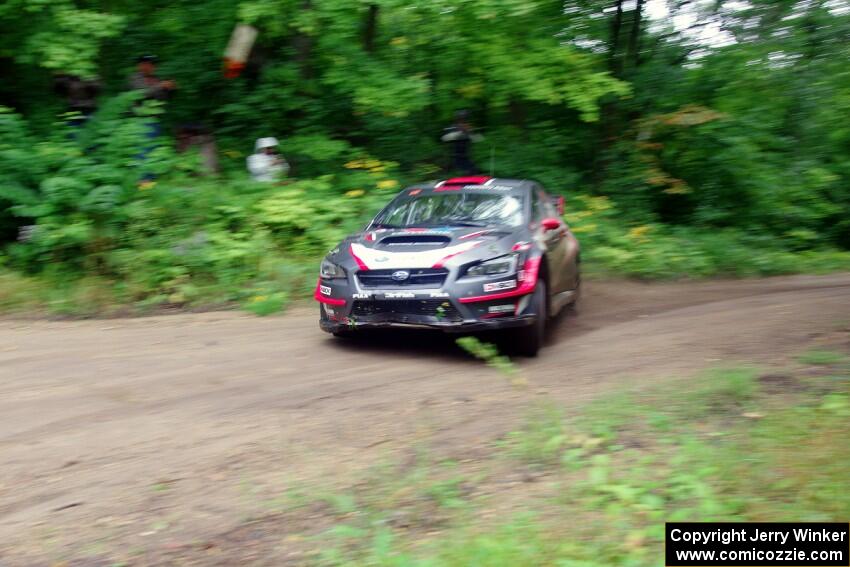 Travis Pastrana / Robbie Durant Subaru WRX STi comes through the VIP spectator corner on SS8, Perkins Road.