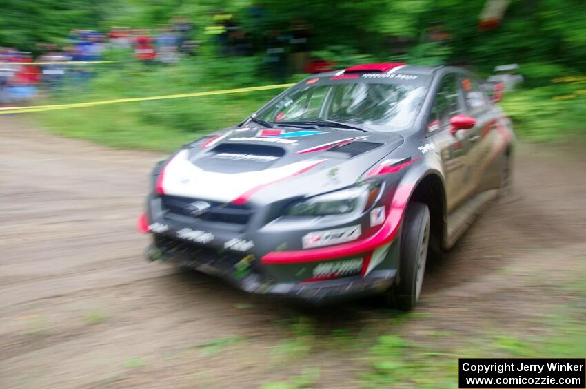 Travis Pastrana / Robbie Durant Subaru WRX STi comes through the VIP spectator corner on SS8, Perkins Road.