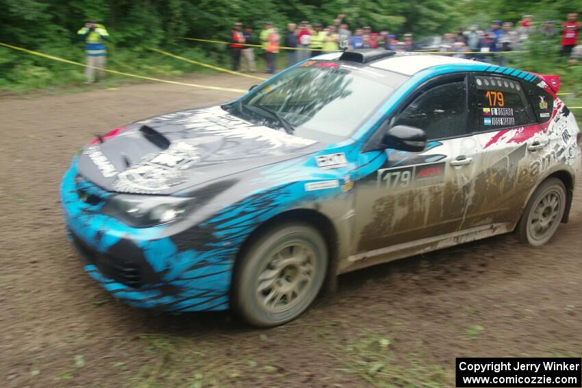 Dennis Romero / Jose Maria Rodriguez Subaru WRX STi comes through the VIP spectator corner on SS8, Perkins Road.