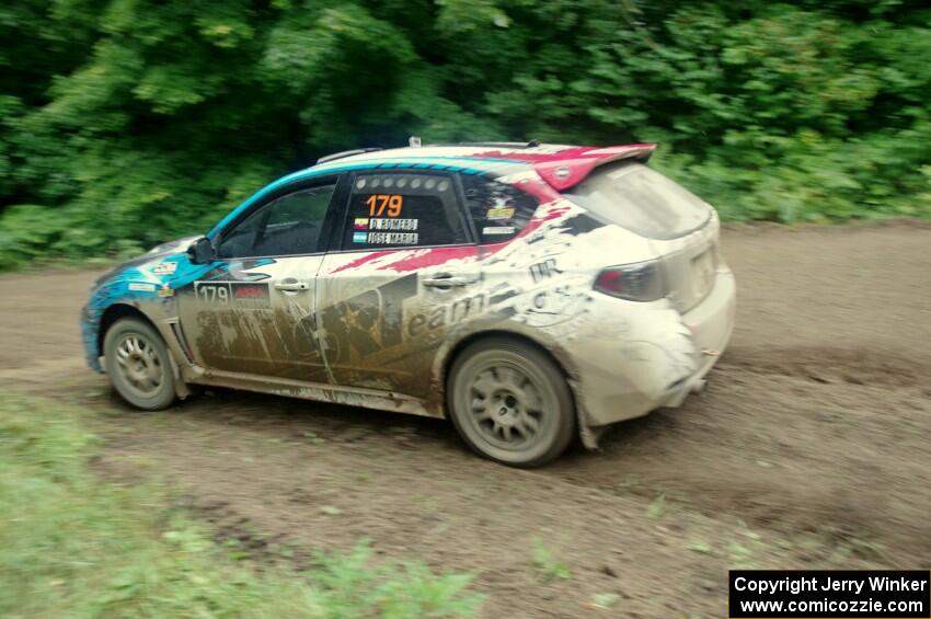 Dennis Romero / Jose Maria Rodriguez Subaru WRX STi comes through the VIP spectator corner on SS8, Perkins Road.