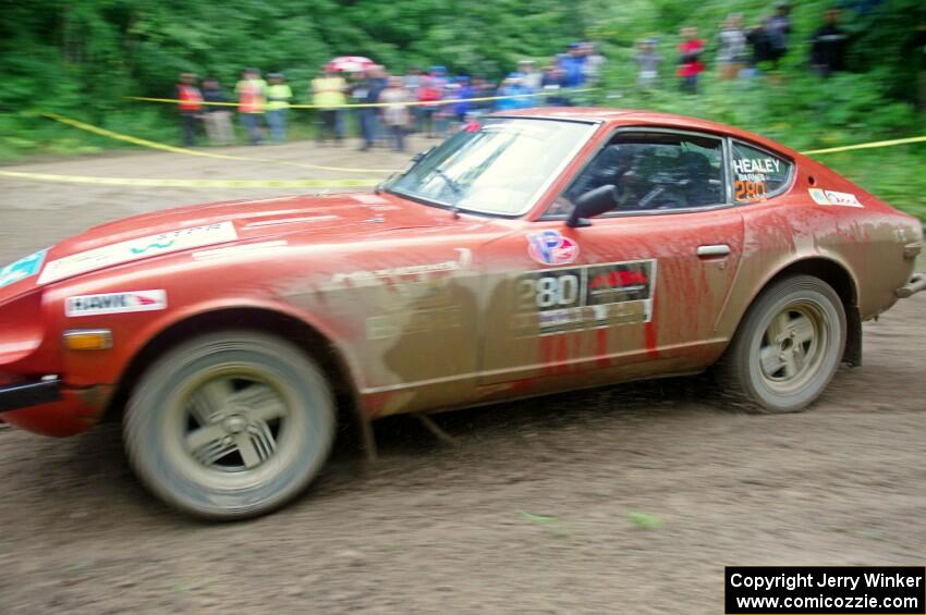 Greg Healey / Phil Barnes Datsun 280Z comes through the VIP spectator corner on SS8, Perkins Road.