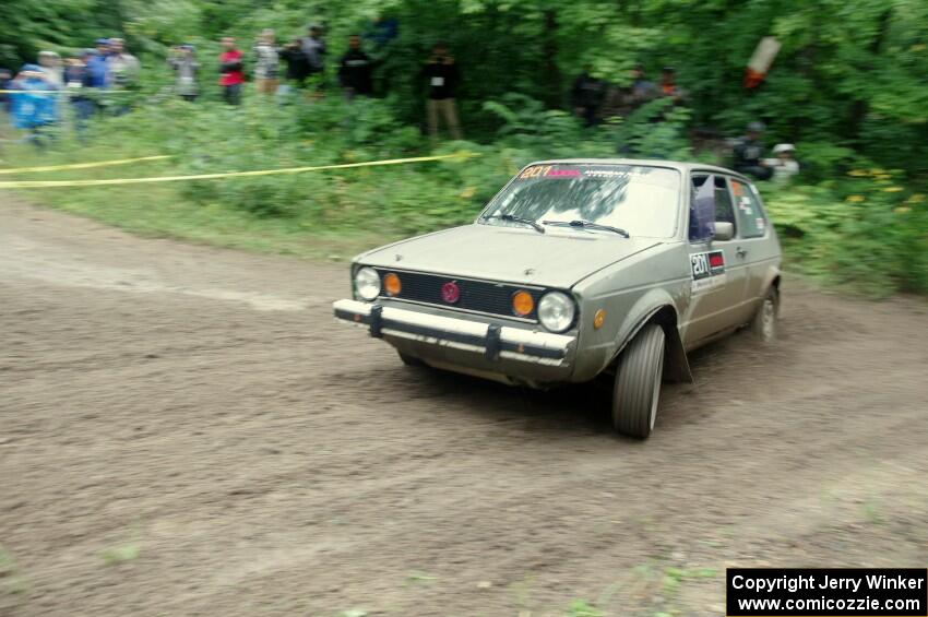 Adam VanDamme / Jake Carlson VW Rabbit comes through the VIP spectator corner on SS8, Perkins Road.