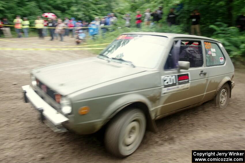 Adam VanDamme / Jake Carlson VW Rabbit comes through the VIP spectator corner on SS8, Perkins Road.