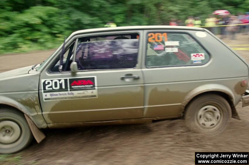 Adam VanDamme / Jake Carlson VW Rabbit comes through the VIP spectator corner on SS8, Perkins Road.