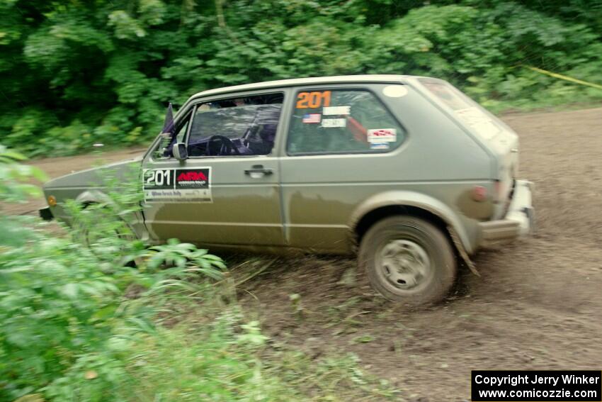 Adam VanDamme / Jake Carlson VW Rabbit comes through the VIP spectator corner on SS8, Perkins Road.