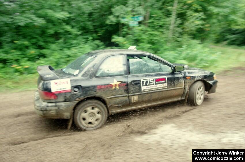 Kristian Rue / Mark Rue Subaru Impreza 2.5RS comes through the VIP spectator corner on SS8, Perkins Road.