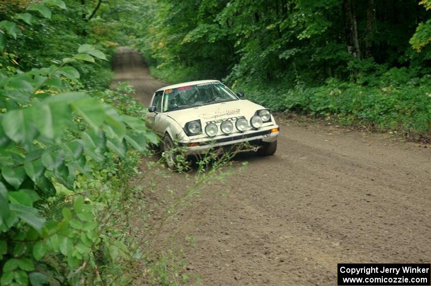 Mike Halley / Jimmy Brandt Mazda RX7 GSL-SE comes into the VIP spectator corner on SS8, Perkins Road.