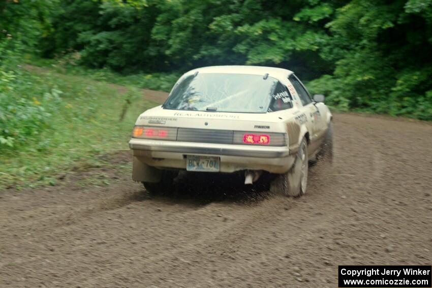 Mike Halley / Jimmy Brandt Mazda RX7 GSL-SE comes through the VIP spectator corner on SS8, Perkins Road.