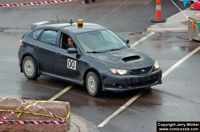 Car 0, a Subaru Impreza, clears the course.