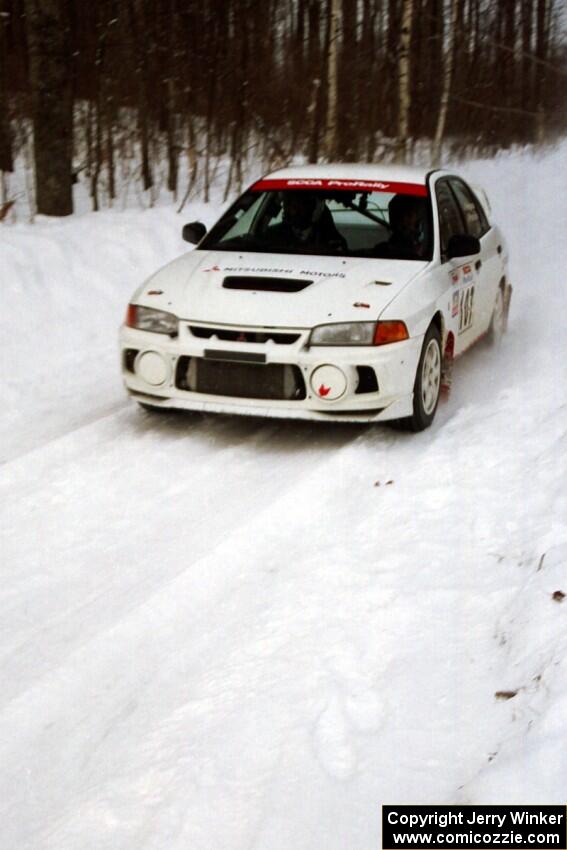 Tim Paterson / Scott Ferguson Mitsubishi Lancer Evo IV at speed on SS1, Hardwood Hills Rd.