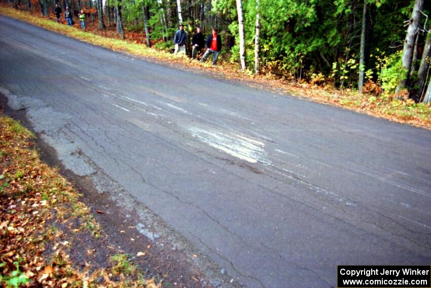 Mark Nelson / Alex Gelsomino Mitsubishi Lancer Evo VI left a huge mark in the pavement after landing on SS16, Brockway Mt.