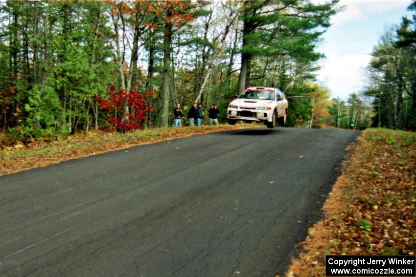 Tim Paterson / Scott Ferguson Mitsubishi Lancer Evo IV at the midpoint jump on SS16, Brockway Mt.