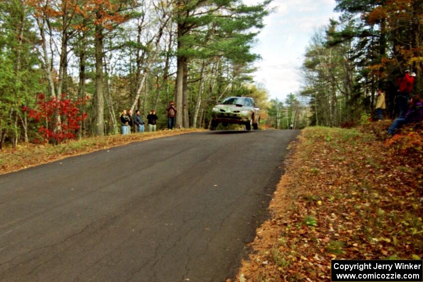 Tad Ohtake / Bob Martin Ford Escort ZX2 at the midpoint jump on SS16, Brockway Mt.