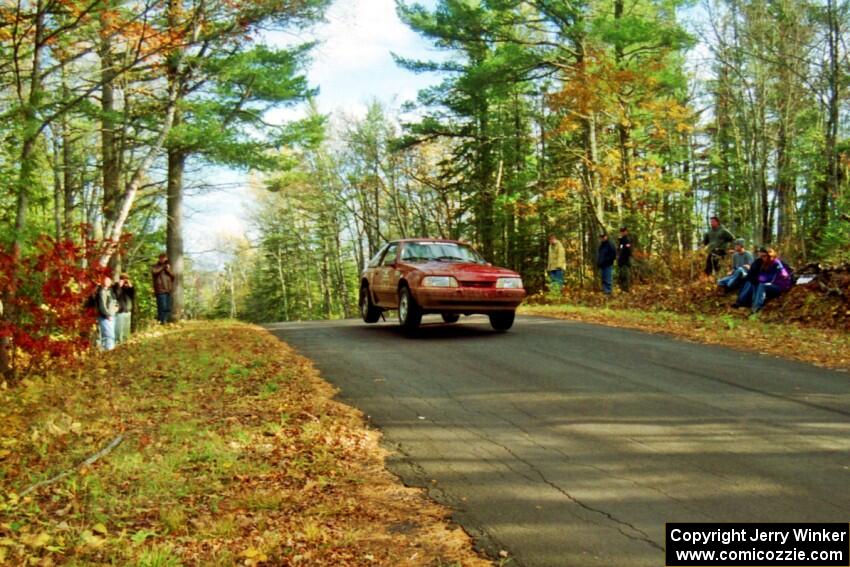 Jeremy Butts / Jon Vrzal Ford Mustang GT at the midpoint jump on SS16, Brockway Mt.