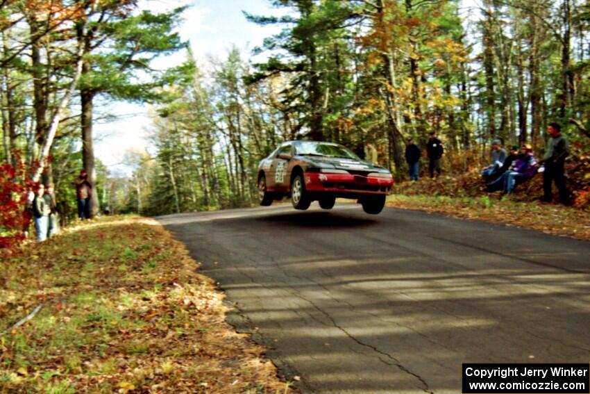 Dennis Martin / Chris Plante Mitsubishi Eclipse GSX at the midpoint jump on SS16, Brockway Mt.