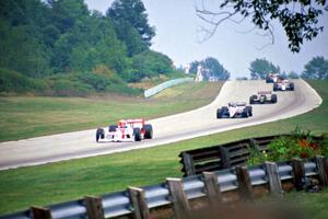 Emerson Fittipaldi's Penske PC-21/Chevy leads the pack into turn 3.