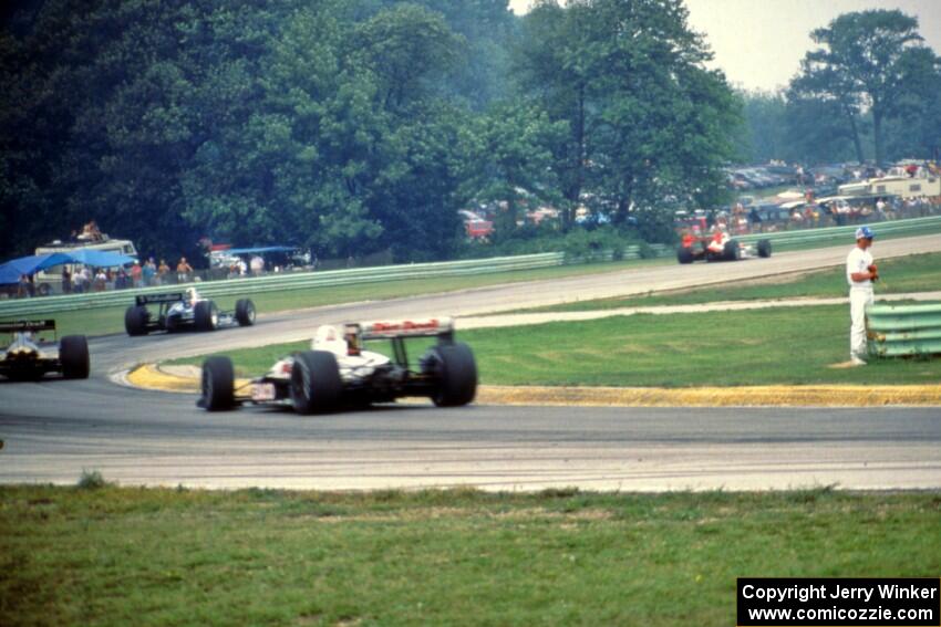 The top four head through turn 3 during the final laps.