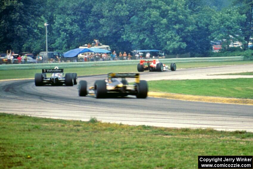 The top three head through turn 3 on the final lap.