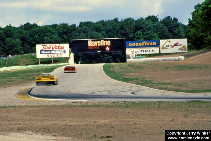 Scott Sharp's Chevy Camaro chases Jeff Purner's Chevy Camaro