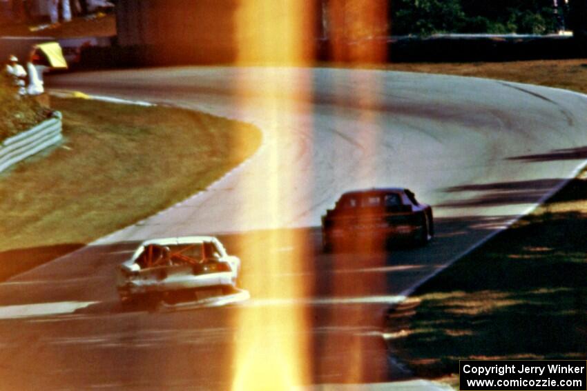 Bill Gray's Chevy Camaro, drags bodywork uphill toward turn 13.