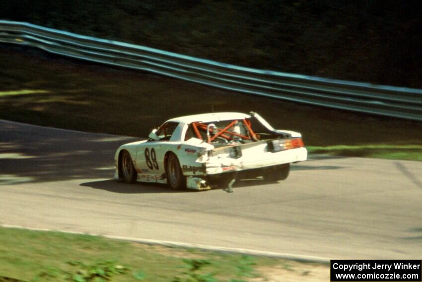 Bill Gray's Chevy Camaro has lost even more bodywork at the end of the race.