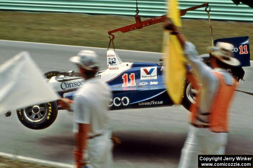 Adrian Fernandez's Lola T-93/07/Chevy comes by on the hook after colliding with the wall at the kink.