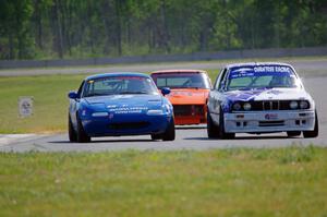 Mike Campbell's ITA BMW 325is, Paul Pridday's Spec Miata Mazda Miata and Tim Homes' E Production Datsun 240Z