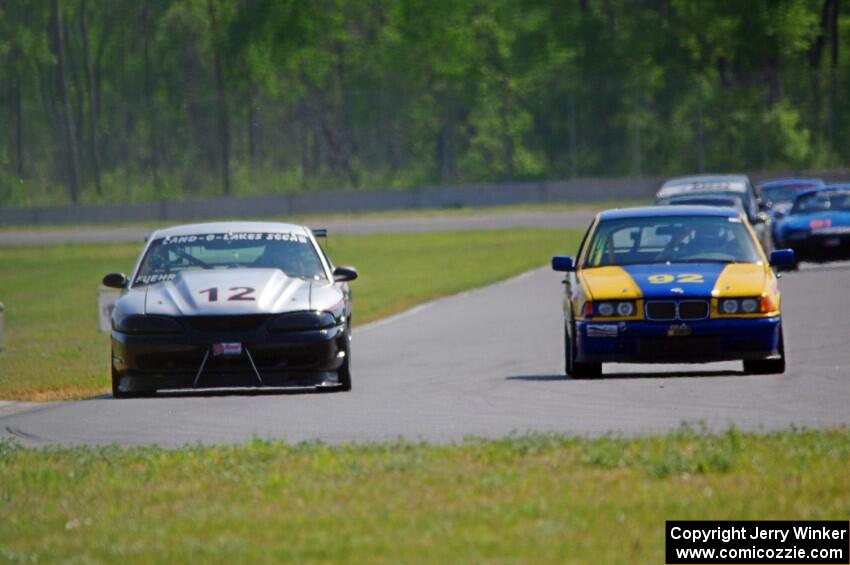 Tom Fuehrer's ITE-1 Ford Mustang and Scott Sinnott's ITR BMW 325i