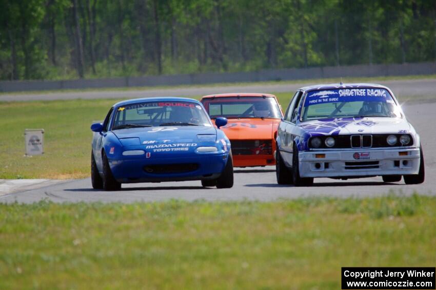 Mike Campbell's ITA BMW 325is, Paul Pridday's Spec Miata Mazda Miata and Tim Homes' E Production Datsun 240Z