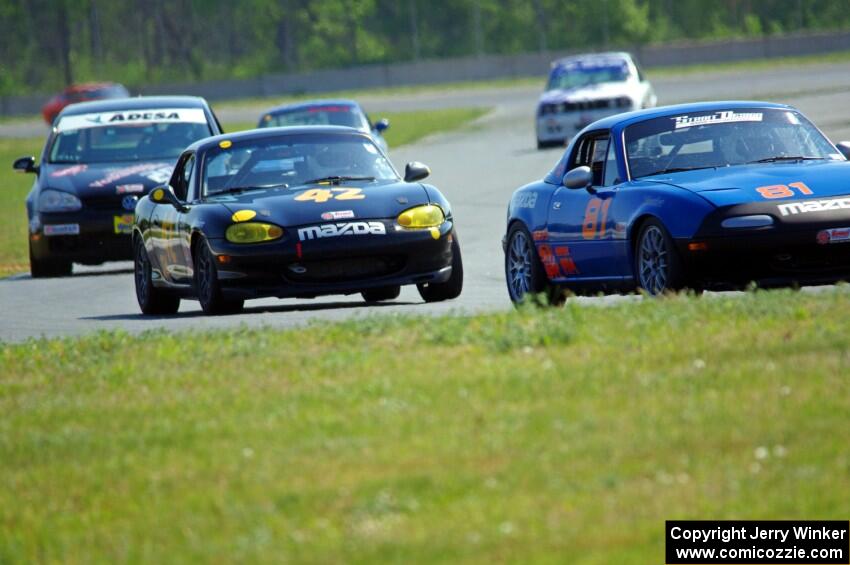 Gordon Kuhnley's Spec Miata Mazda Miata, Greg Youngdahl's Spec Miata Mazda Miata and Tom Daly's STU VW Rabbit