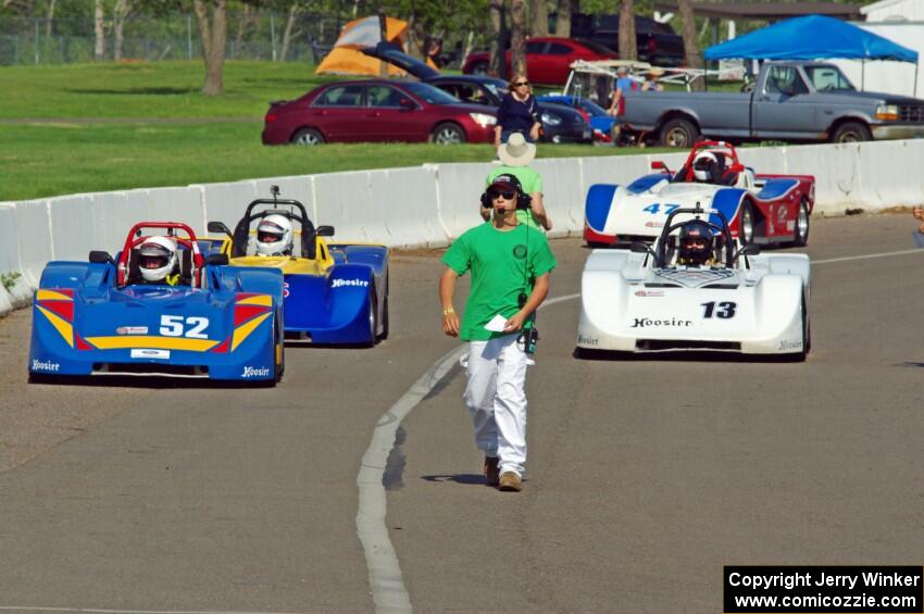 Four Spec Racer Fords line up on the false grid for the final race of the day.