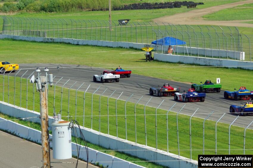 The field comes into turn 12 on the pace lap.