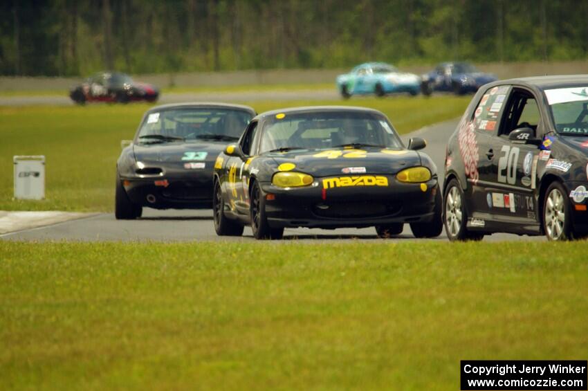 Tom Daly's T4 VW Rabbit, Greg Youngdahl's Spec Miata Mazda Miata and Cody Lindman's STL Mazda Miata