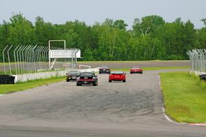 Five cars blast down the front straight into turn 1.