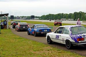 Cars line up at the scales after the race.