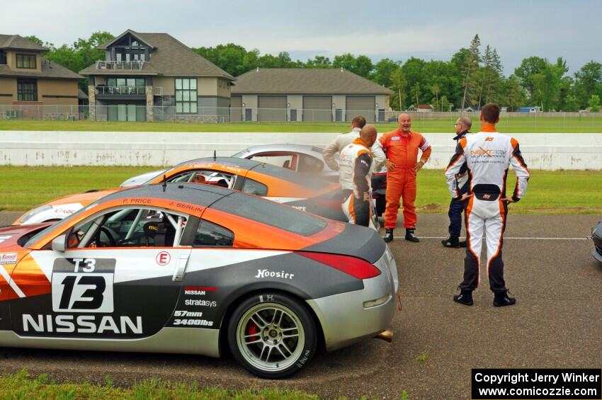 Patrick Price's and James Berlin's Nissan 350Zs, post-race, while others gather around.