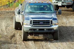 A Ford F-350 Pickup sweep vehicle comes through the spectator location on SS9, Arvon-Silver I.