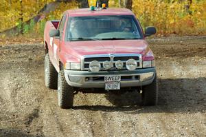 A Dodge Ram Pickup sweep vehicle comes through the spectator location on SS9, Arvon-Silver I.