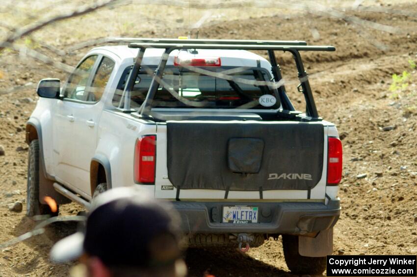 A Chevy Colorado ZR2 Pickup sweep vehicle comes through the spectator location on SS9, Arvon-Silver I.